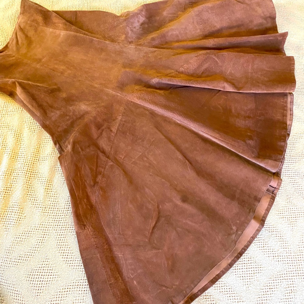 Long split leather skirt. High waisted with back zipper.